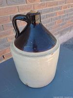 Front view of two-tone stoneware jug showing overall form, handle and cream body