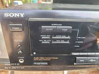 Front left showing Sony logo, power button, surround controls