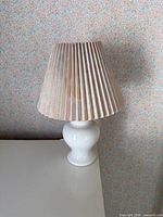 Full view of lamp with shade on table