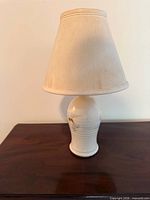 Full view of pottery lamp with shade