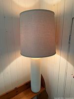 Table lamp lit with shade on