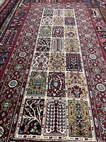 Full view perspective of rectangular runner rug showing garden panel design and border