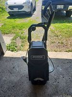 Front view of Simoniz 1750 PSI pressure washer showing brand badge and overall condition