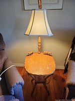 Full view of table and lamp showing overall design and wear