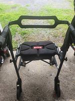 Top view of Nexus rollator showing padded seat, handlebar, wheels