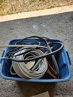 Blue tote with various coiled wires and cables