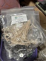 Bag of HTP 1312 pre-tabbed wicks visible in basket