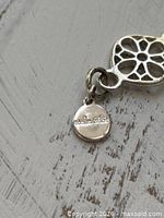 Close-up of Stella & Dot maker’s tag on necklace