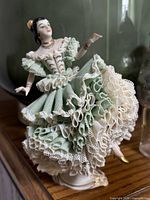 Front view of lace Dresden dancer showing dress detail and pose