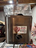 Front view showing Cuisinart branding, capacity sticker, control dial