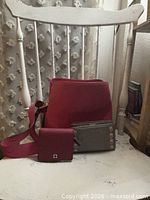 Group shot of purse and two wallets