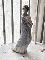 Front view of Lladro Milanese Lady figurine showing full attire and pose