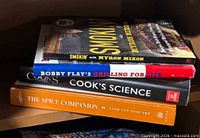 Stack of four identifiable cookbooks