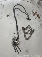 Both Stella & Dot necklaces laid flat showing pendants and chain lengths