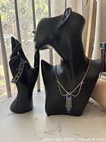 Necklace on bust and bracelet on hand display