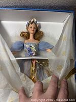 Harpist Angel Barbie inside box, doll secured, showing gown and accessories