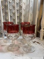 Four ruby flashed King's Crown wine goblets front view