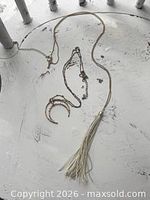 Overview of both necklaces laid flat