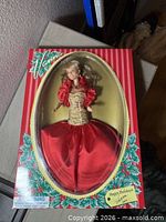 Holiday edition Vanna White doll boxed, red striped holly border packaging