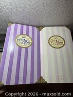 Front view of both striped P.F.E. Albee Barbie boxes