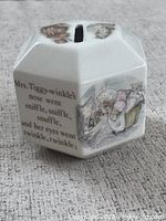 Overall view showing coin slot and one illustrated panel with quote
