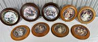 Front view of nine framed collector plates