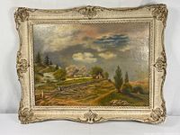 Front view of framed oil landscape painting