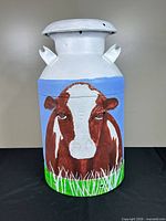 Full view of painted BORDENS milk can front