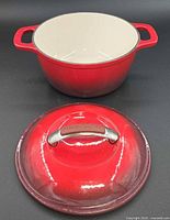 Dutch oven with lid displayed separately, showing exterior color and overall form
