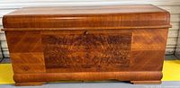 Front view of Lane cedar blanket chest showing walnut veneer and lock