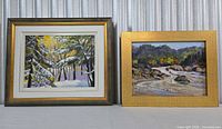 Both framed paintings side by side