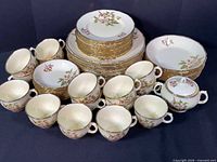 Entire set with plates, bowls, cups, sugar bowl and lid displayed