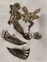 Group shot showing brooch and two earring pairs