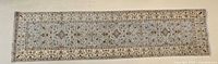 Full length view of runner rug showing overall design and colors