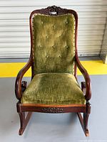 Front view of rocking chair showing full structure and upholstery