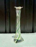 Full view of vase showing green spiral and clear glass body