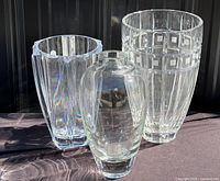 Three of the four crystal vases showing overall shapes