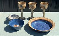 All six pottery items set out together