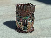 Front view of iridescent Indian Head toothpick holder