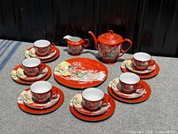 Full view of complete tea set layout showing all pieces and matching decoration