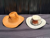 Both cowboy hats side by side