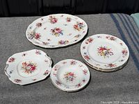 Group shot of all nine Hammersley floral china pieces