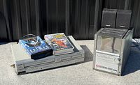 Full lot showing Sanyo player with tapes and RCA stereo with speakers