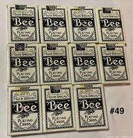 Eleven Bee Club Special No.92 playing card decks in black-on-white tuck boxes arranged in three rows