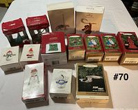 Group shot of all 14 ornament boxes on table