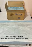 Open carton showing model code SP13150 and size 23" x 36"