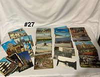 Overview of stacks of postcards spread on table