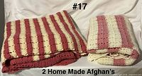 Both folded afghans showing striped pattern and colors