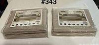 Two sealed Chiara Rose Diamond Camel furniture protectors on table