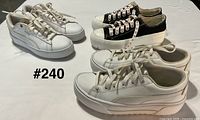 Three pairs of sneakers side view showing brands and colors